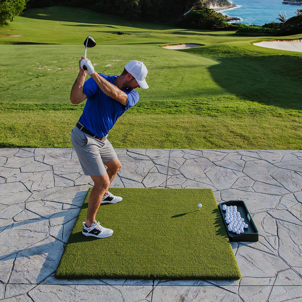 Do you put a traditional tee in the mat to hit Driver or is there a rubber tee with a whole in the mat?